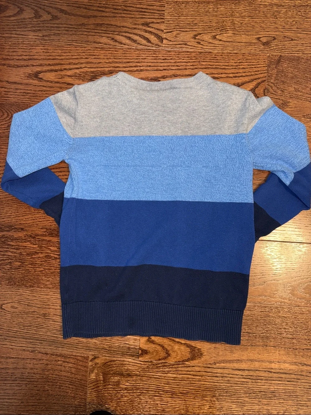 Size medium/7-8 boys blue and gray colorblock stripe crewneck sweater.